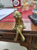 A Brass Decorative Figurine Of A Cat Sitting