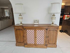 A George III Style Breakfront Cabinet The Shaped Top Above Four Doors, The Central Pair Fitted