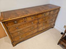 A George III Style Walnut Banded Nine Drawer Bank Of Drawers The Canted Rectangular Top Over An