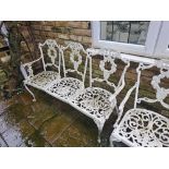 A Regency Style Cast Iron Garden Furntiure Set Comprising Of A Three Seater Love Bench And A Pair Of