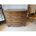 A George III Mahogany And Satinwood Banded Bowfront Chest With Four Graduating Drawers On Splayed