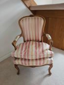 A Louis XV Style Beechwood Fauteuil The Shaped Rectangular Back With Floral Cresting, Striped