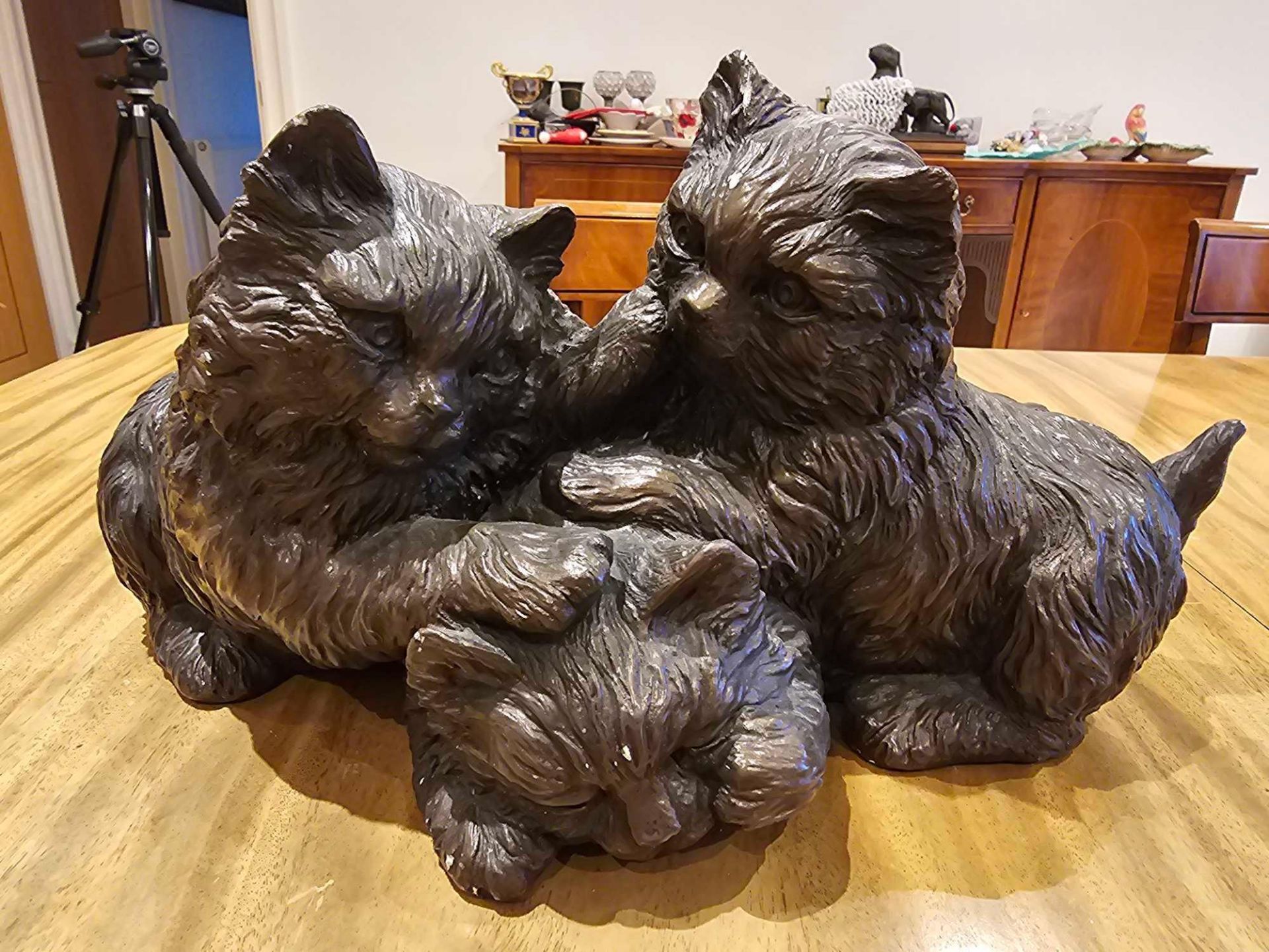 A Resin Figurine Of A Trio Of Kittens