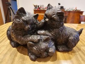 A Resin Figurine Of A Trio Of Kittens