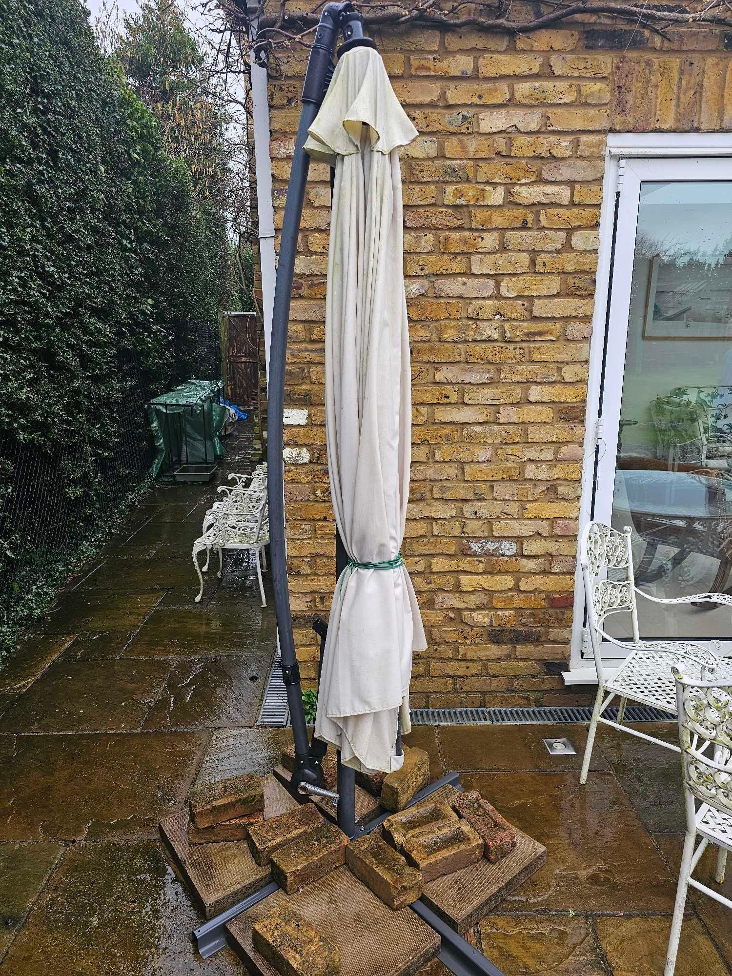 A Wrought Iron Painted White Glass Topped Garden Table Complete With 4 Chairs And A Parasol With - Image 5 of 6