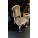 A Pair Of French Rococo Style Chairs With Sculpted Legs And Carved Details. The Seat Pad And