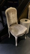 A Pair Of French Rococo Style Chairs With Sculpted Legs And Carved Details. The Seat Pad And