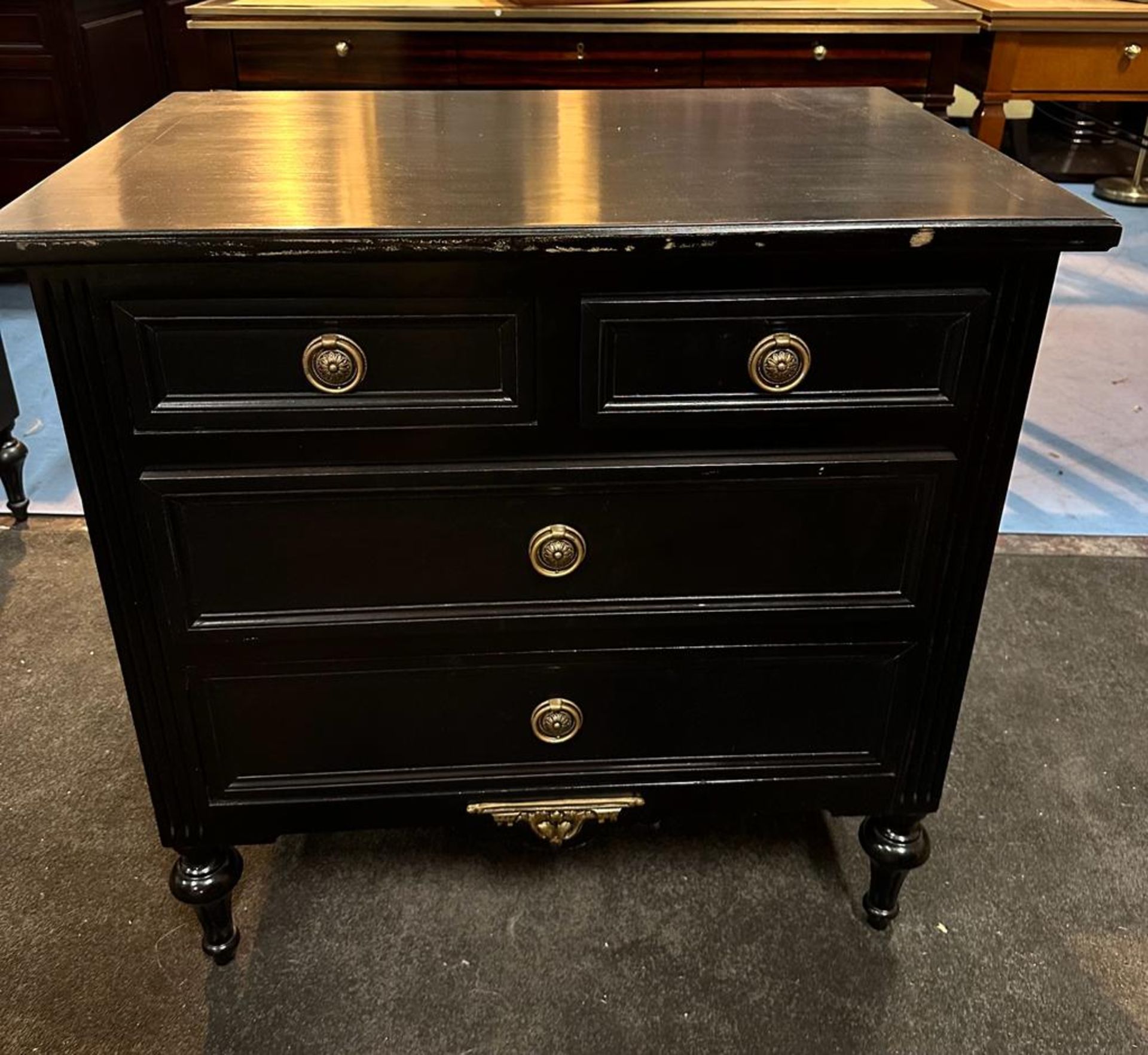 A Pair Four Drawer Commode Chests Raised By Four Block Feet With A Square Carved Motif And Scrolled