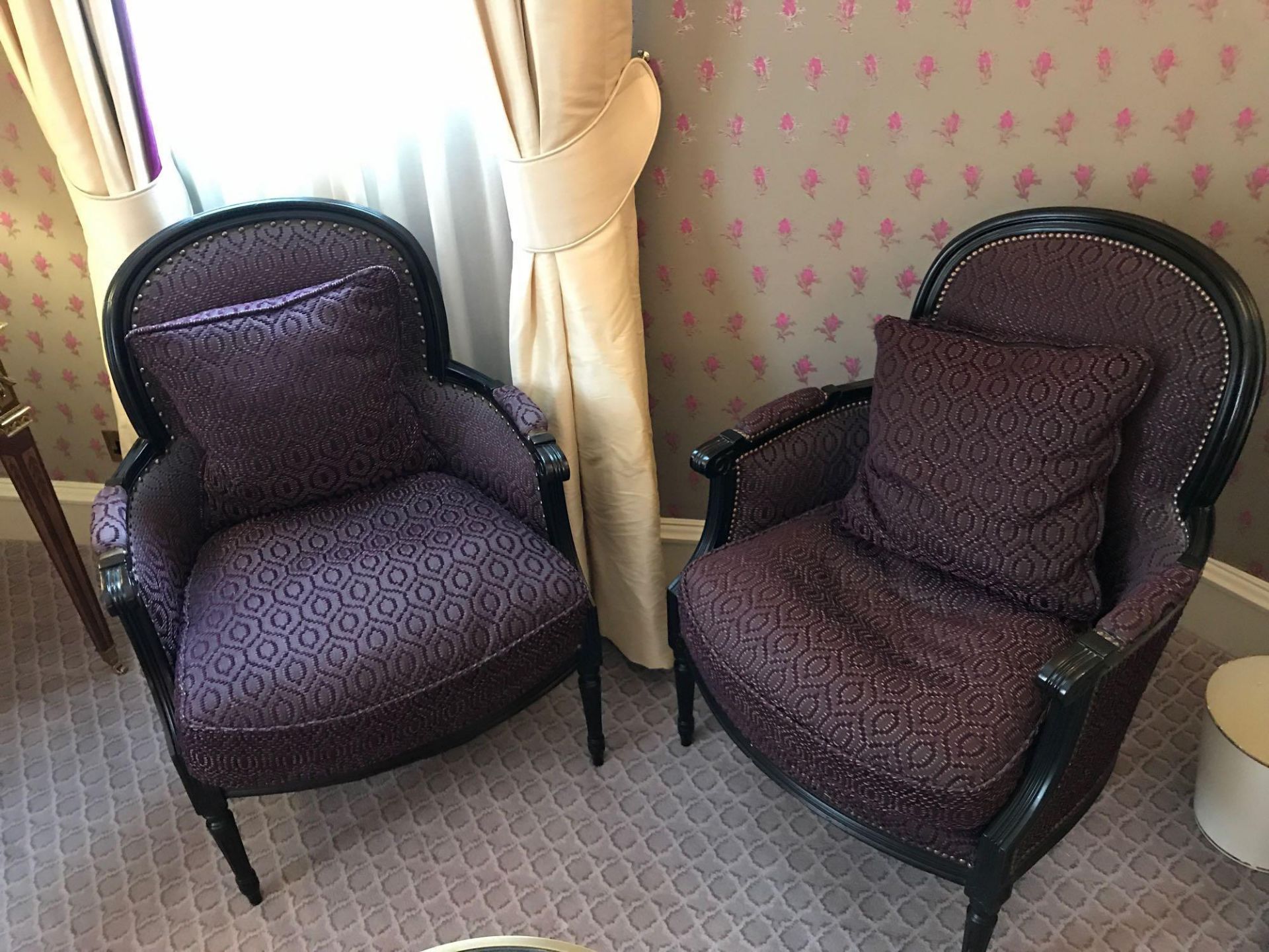 A Pair Of Bergere Chairs Black Wood Frame Upholstered In A Dark Mauve Pattern With Stud Pin Detail