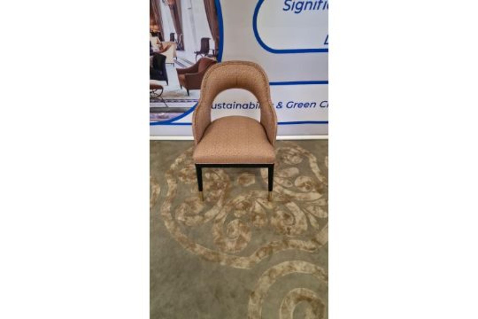 A pair of Turnell and Gigon Fabric Upholstered Armchairs On Ebony Wooden Frames With Brass Sabots