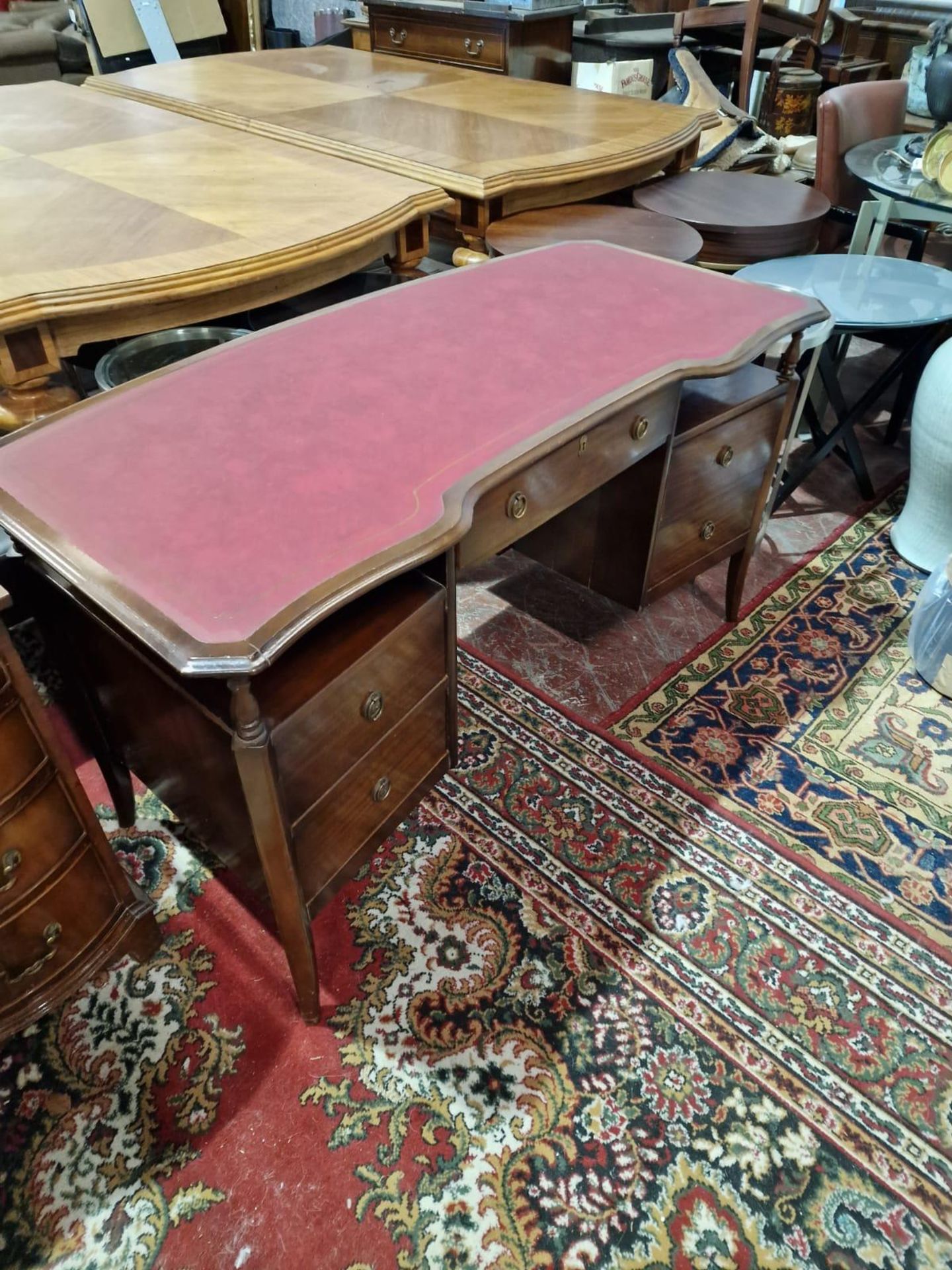 A Twin Pedestal Mahogany Desk Shaped Top Adorned With A Finely Tooled Leather Inset With Central