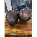 A Decorative Full Leather Rugby Ball And A Leather Football