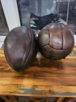 A Decorative Full Leather Rugby Ball And A Leather Football