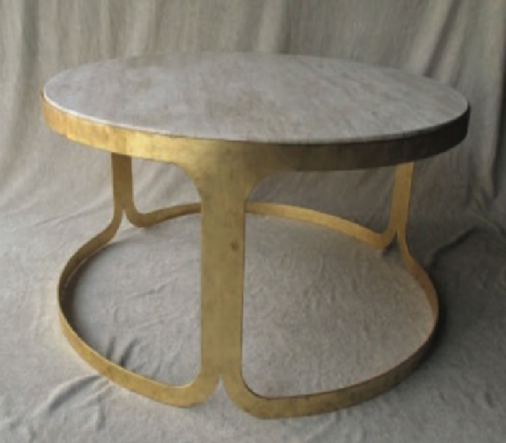 Luxor Coffee Table Featuring a hand-crafted solid travertine top with a gilt-leafed metal frame as