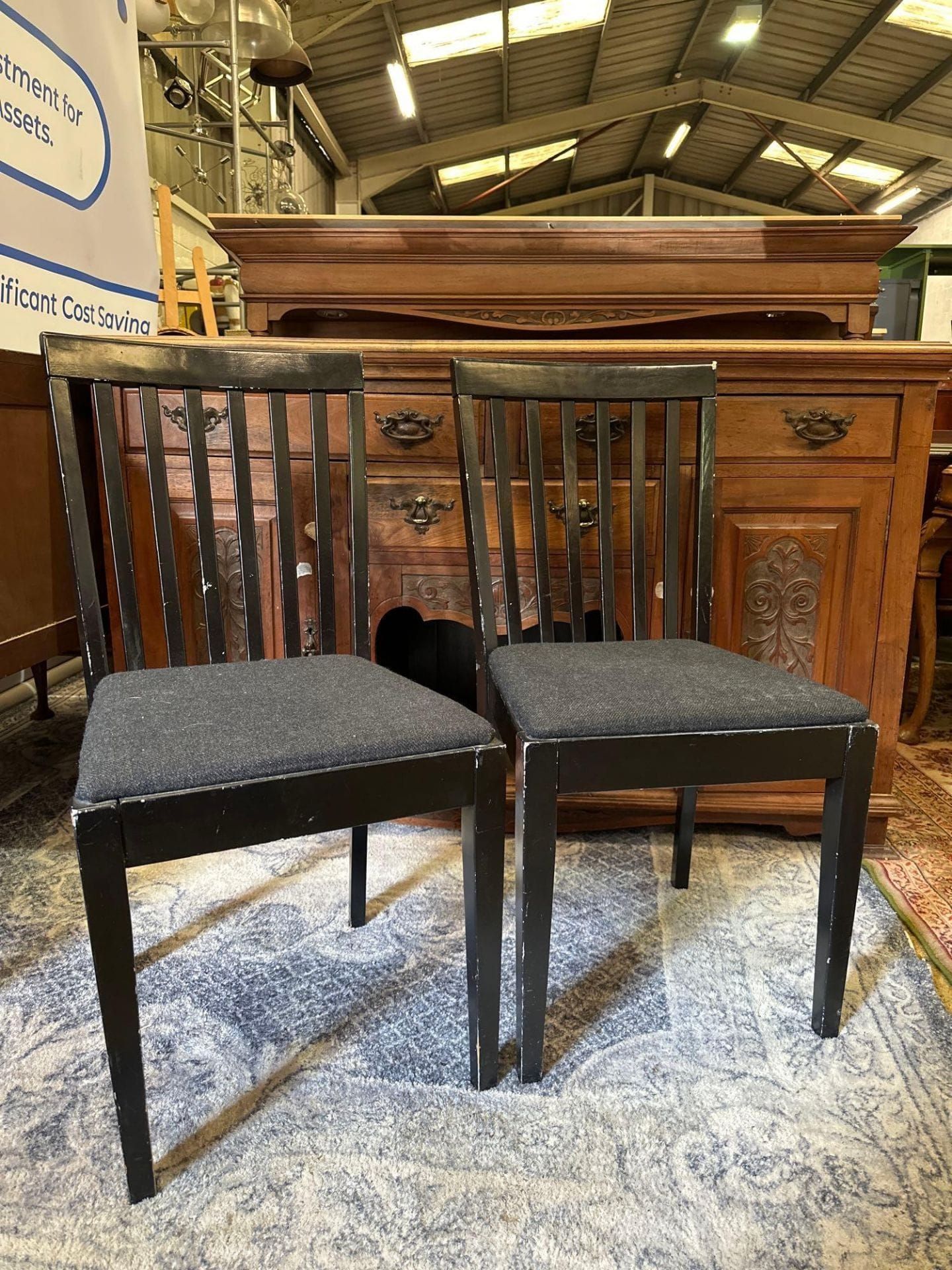 4 x Dining Chairs The dining chair has an ebonised slatted back frame and a grey upholstered seat