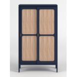 Reed Cabinet The Reed Cabinet offers a large amount of storage space with its black doors and