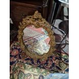 French Style Oval Gold Ornate Wall Mirror Complimenting The Ornate Designs Beautifully Well, The