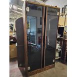 A Tall Double Glass Door Storage Cabinet 10 Cubby Shelfs Internally Behind Smoked Glass Doors 100