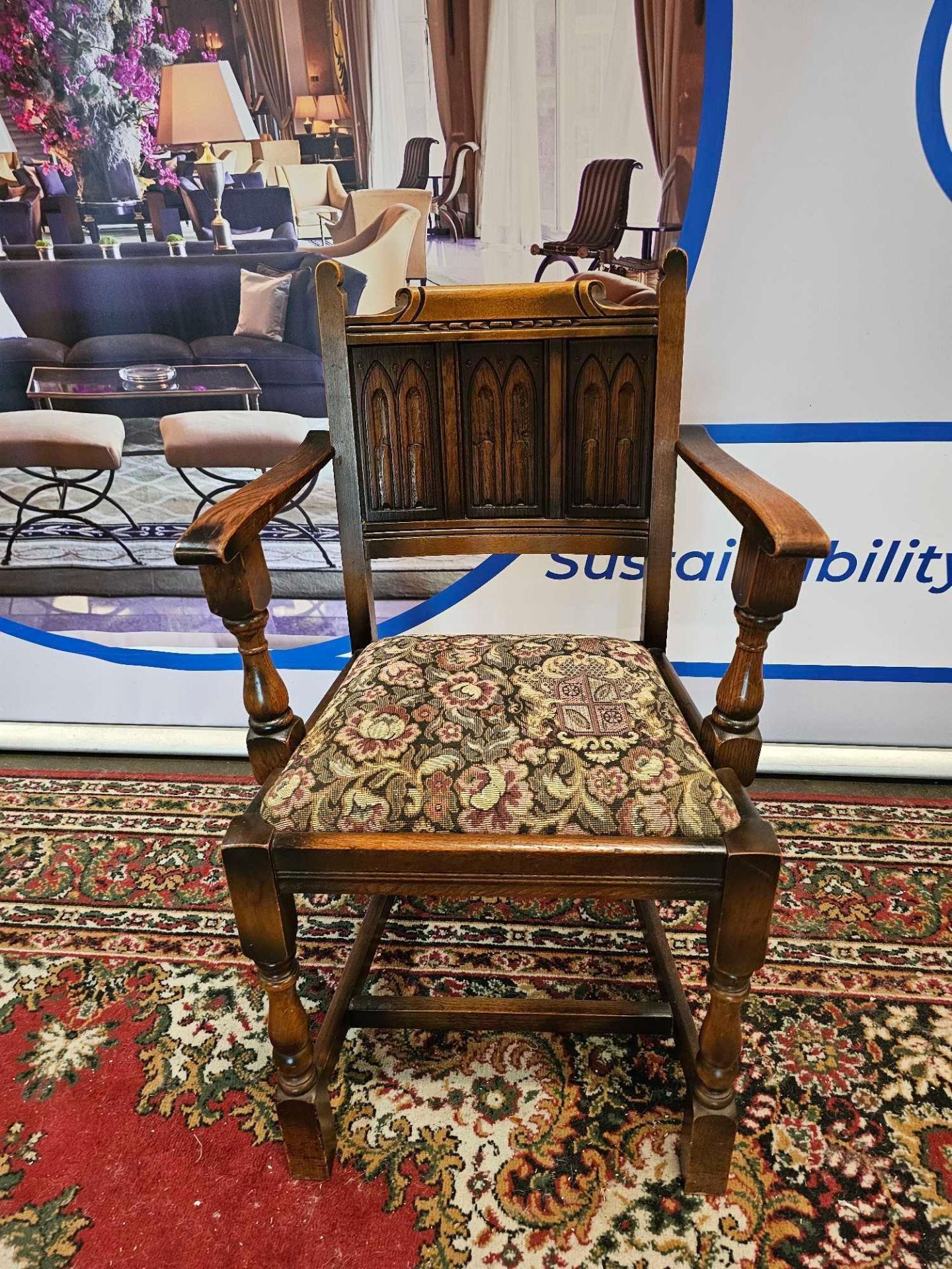 A Pair Of Oak Armchairs The Panelled Carved Back Below A Decorative Top Rail With A Tapestry