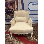 A Pair Of Bergere Chairs White Ornate Wood Frames Upholstered In Natural White Linen With Stud Pin