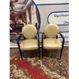 A Pair Of French Style Round Back Armchairs Upholstered In Champagne Gold Leather The Round Back And