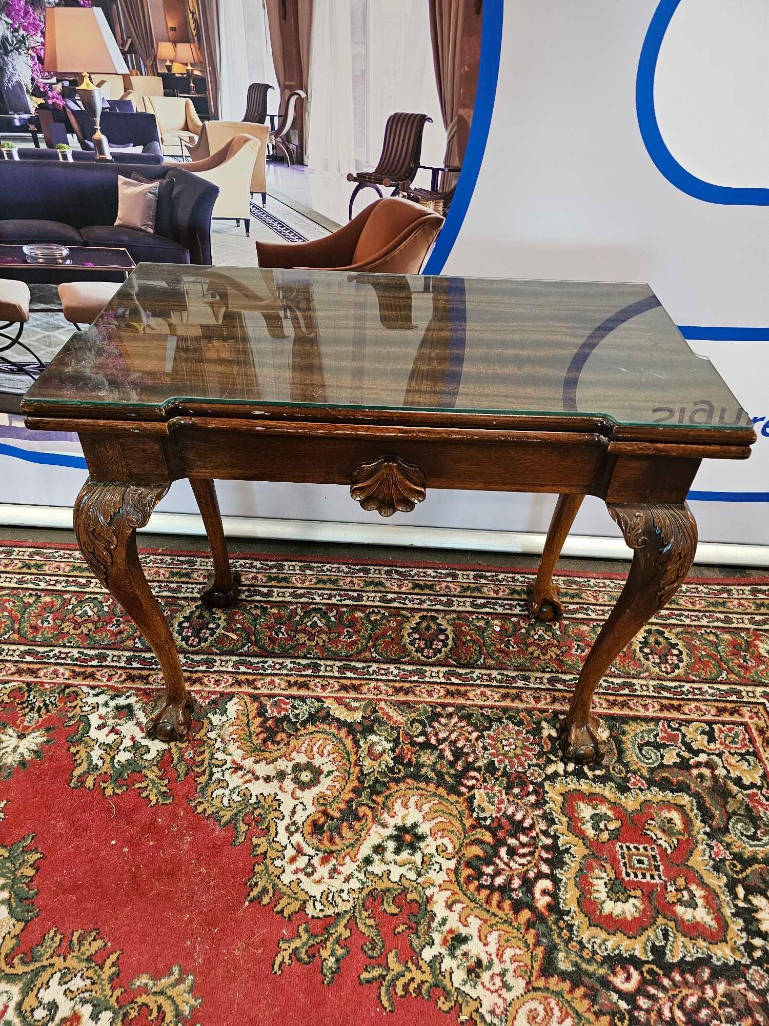 A George II Style Mahogany Tea Table With Central Drawer On Carved Acanthus Knees And Ball Claw Feet