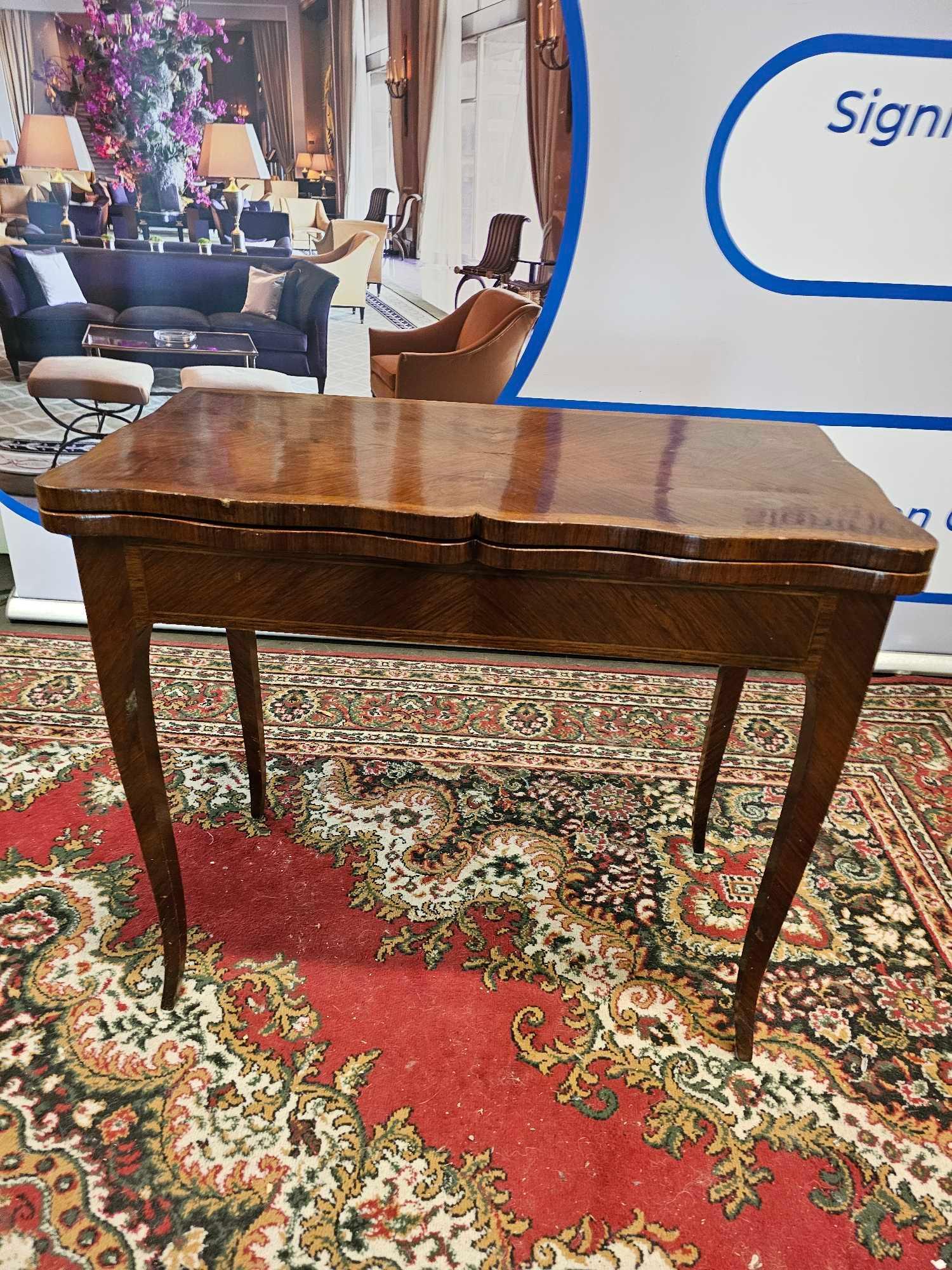 A George III Style Mahogany Serpentine Shape Top Card Table Mounted On Tapering Legs 85 x 43 x