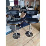 A Pair Of Wooden Gas Lift Bar Stool Black PU Leather Bar Stool With Chrome Base Featuring A Wooden