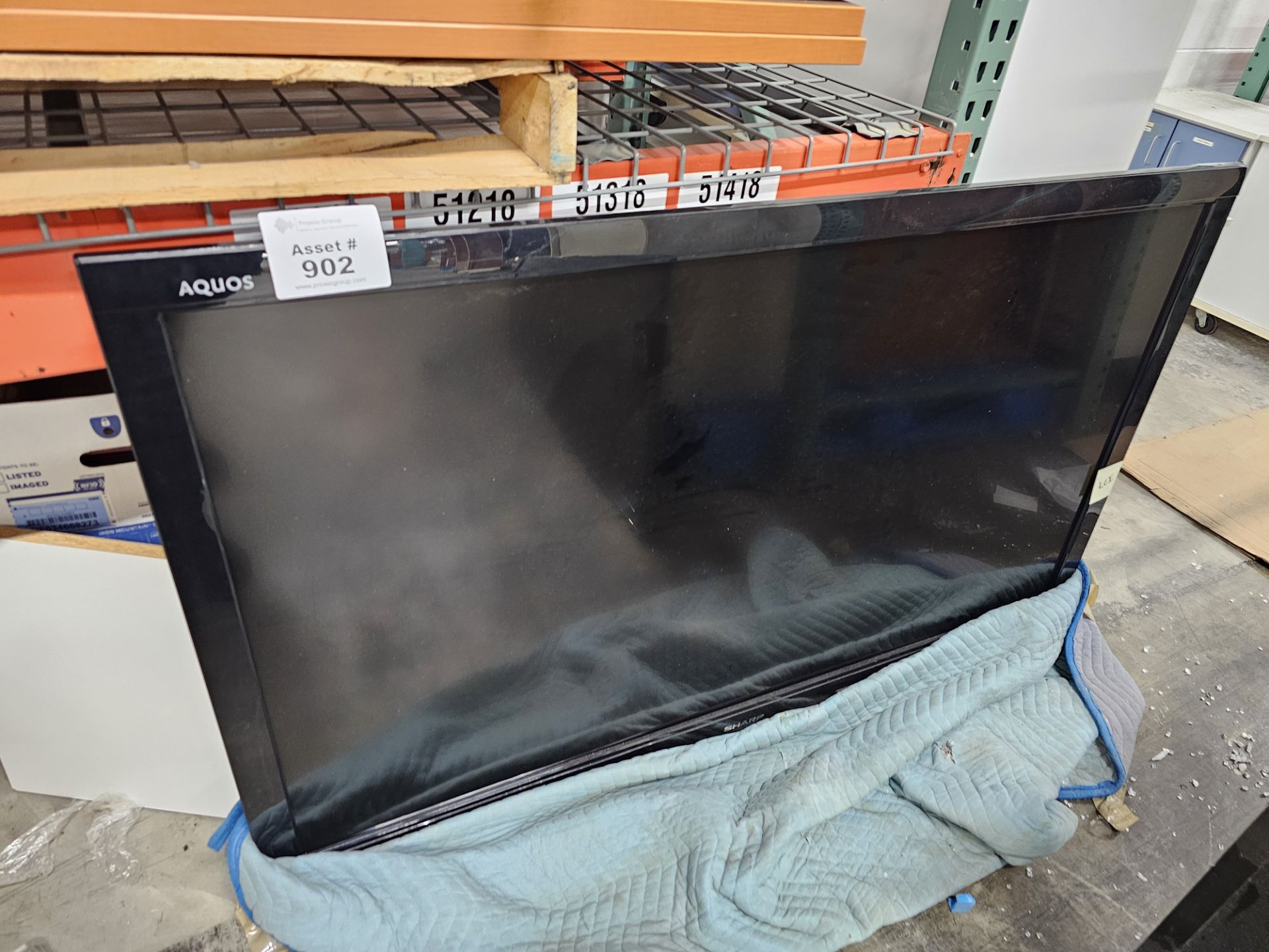 (2) Sharp Aquos TVs (1) Approx 65" TV with Liquid Crystal Display, (1) Approx 50" LCD Display