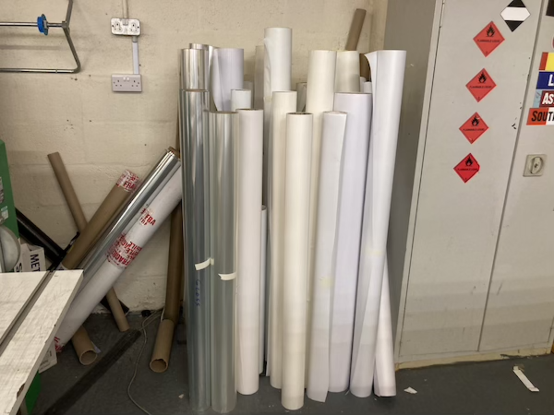 A quantity of white vinyl and paper part rolls, various sizes as lotted