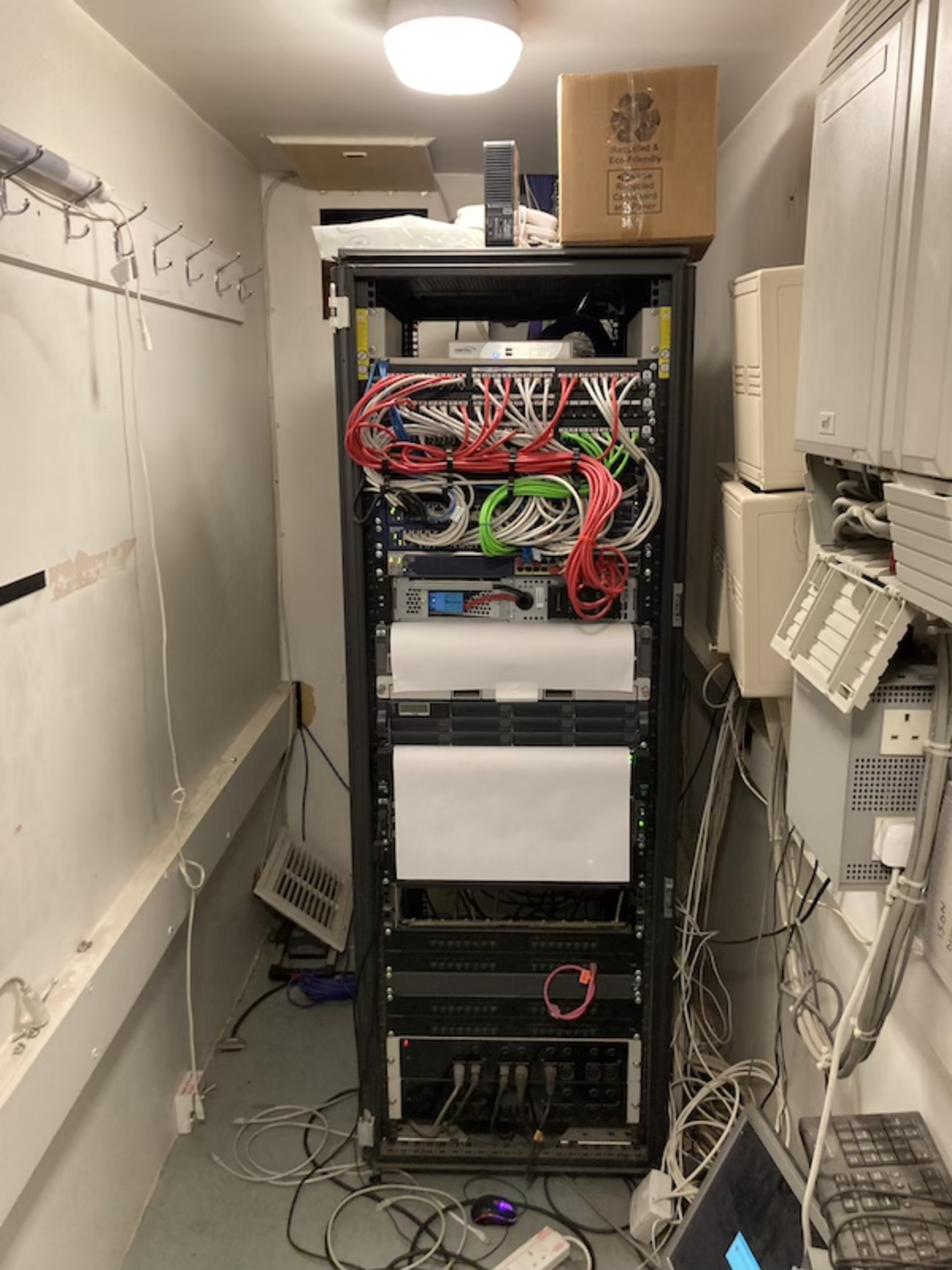 Freestanding data cabinet with contents of IT equipment