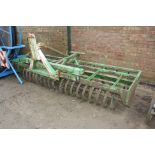 Flexicoil front mounted press with single row of spring tines