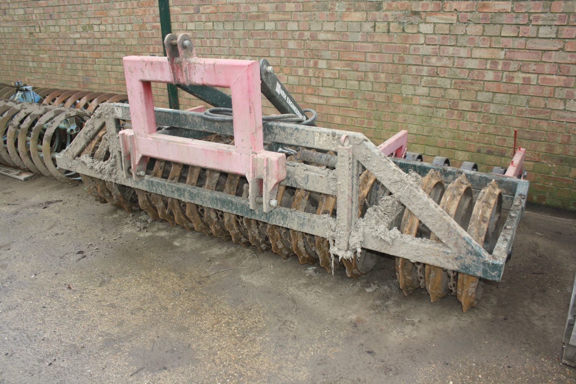 NRH Engineering front mounted press with hydraulic levelling paddles Model P710 RPSH, Serial No 2298