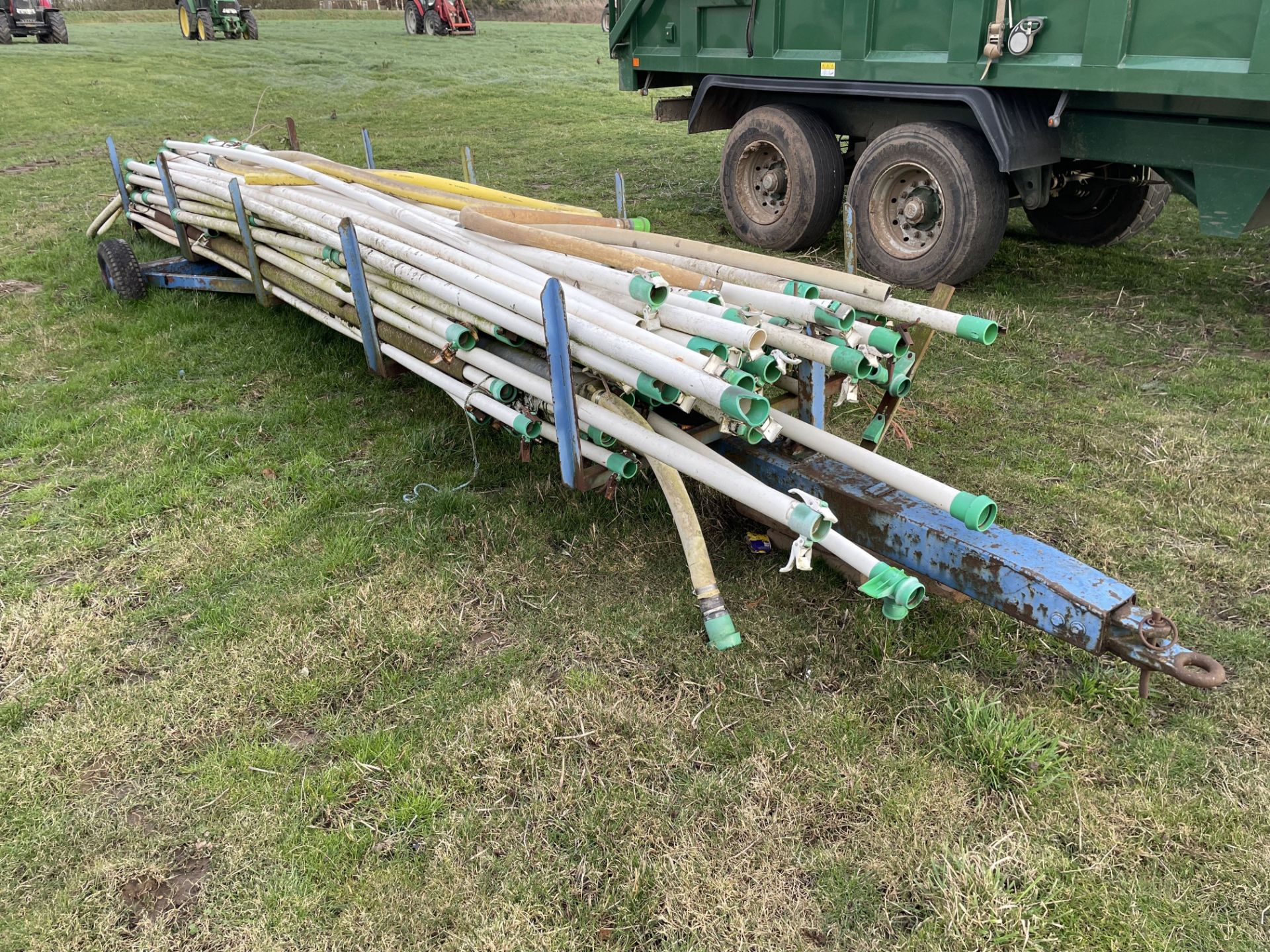 Qty 60mm irrigation plastic pipes on single axle trailer