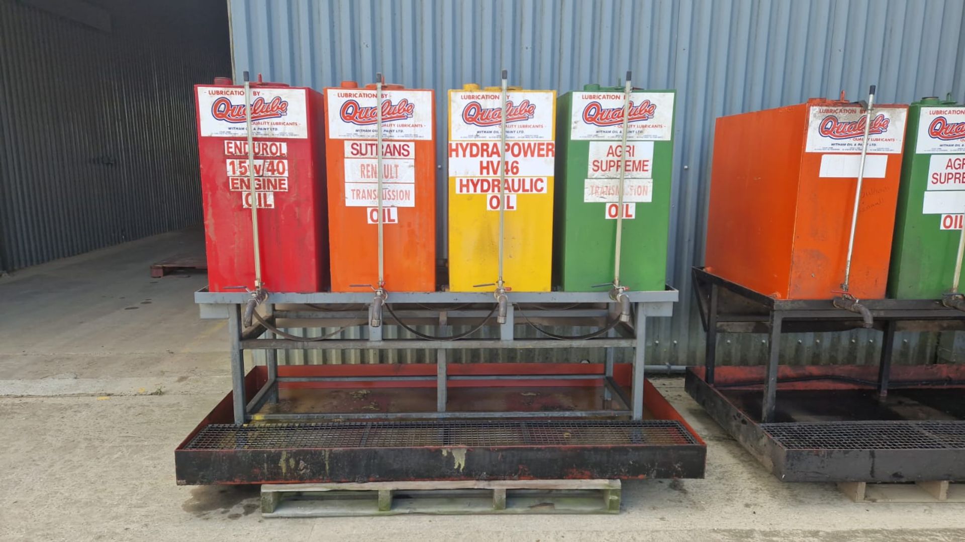 4 x Qualube oil dispenser tanks with stand