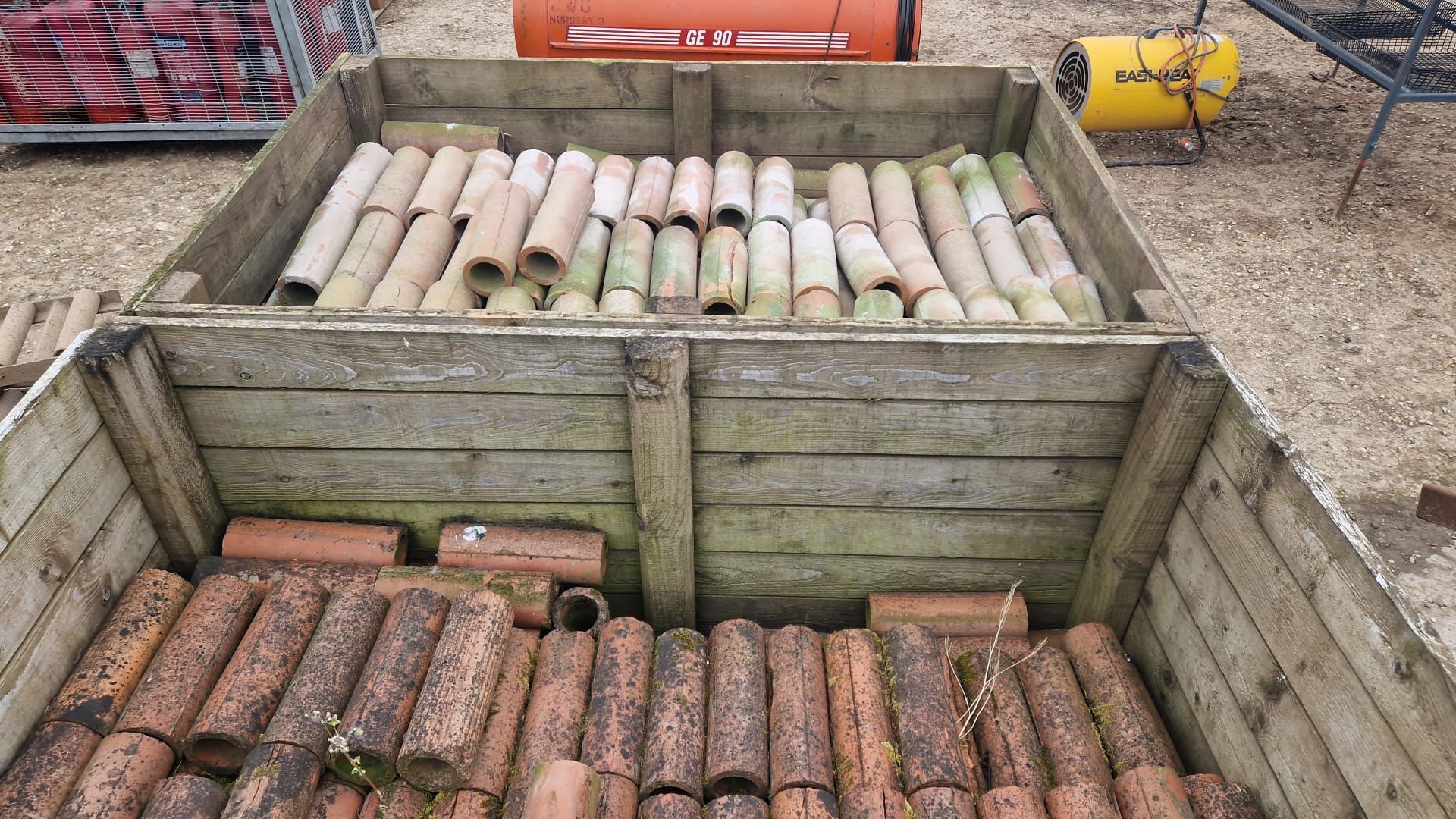 2 boxes of clay drainage pipes