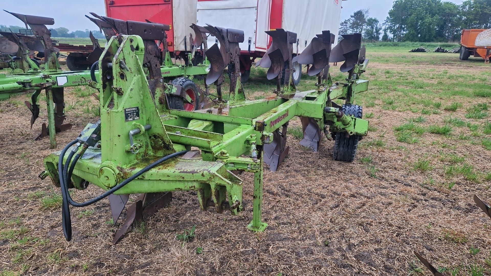 Dowdeswell DP7D2 5f (4+1) plough, rubber land wheel, disc skeiths serial No 51234930