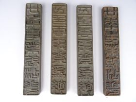 Four metal stamps