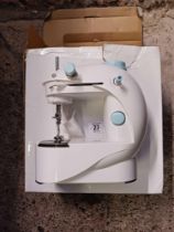 BATTERY POWERED SEWING MACHINE,