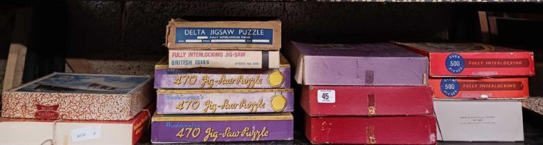 SHELF OF VINTAGE JIGSAW PUZZLES NOT KNOWN IF COMPLETE