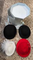 HAT BOX WITH 2 BOWLER HATS IN BLACK & 2 LADIES HATS, 1 RED & 1 WHITE WITH FEATHERS