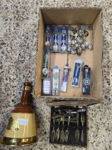 CARTON WITH MISC SOUVENIRS SPOONS, EMPTY WADE BELLS SCOTCH WHISKY DECANTER, TEA SPOONS & CAKE FORKS