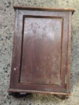 A SMALL WALL MOUNTING WOODEN CABINET