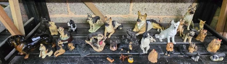 SHELF OF MAINLY RESIN DOG ORNAMENTS