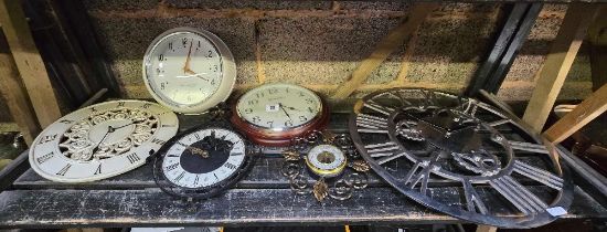 SHELF WITH A COLLECTION OF WALL CLOCKS & A SMALL ANEROID BAROMETER