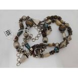 ORNATE TRIBAL STYLE BEAD & STONE SET TRIPLE ROW NECKLACE