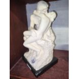 FIGURE OF A YOUNG NAKED COUPLE EMBRACING