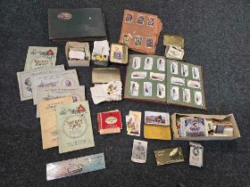 CARTON WITH MISC CIGARETTE CARDS WITH ALBUMS