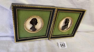 PAIR OF REVERSE GLASS PAINTED SILHOUETTES OF A LADY AND GENTLEMAN IN MATCHING HOGARTH FRAMES,
