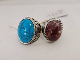 2 LARGE SILVER COLOURED STONE SET GENTS RINGS